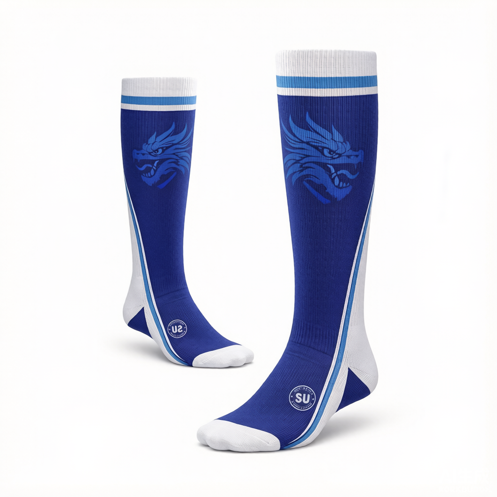 Experience superior match-day performance with Southern Apparel’s Southern ELITE Long Socks—knee-high blue and white athletic socks featuring a striking blue dragon design on the sides and blue and white stripes at the top. Designed for athletes, these socks offer advanced moisture control to keep you comfortable during every game. Displayed on a white background.