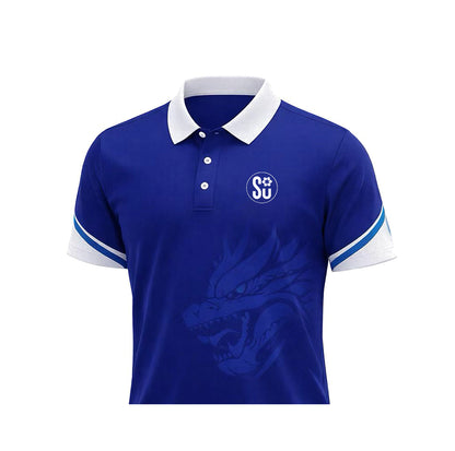 The Southern SIGNATURE Club Polo by Southern Apparel is a blue polo with a white collar and sleeve edges, made from premium fabric. It features a stylized dragon graphic on the front and an SU logo on the left chest, ideal for off-field wear.