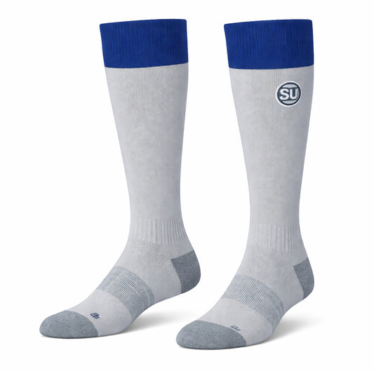 A pair of knee-high, light gray Southern Apparel UMPIRES ONFIELD SOCKS with dark blue cuffs, gray toes and heels, a circular SU logo near the top, and moisture control for enhanced match-day performance.