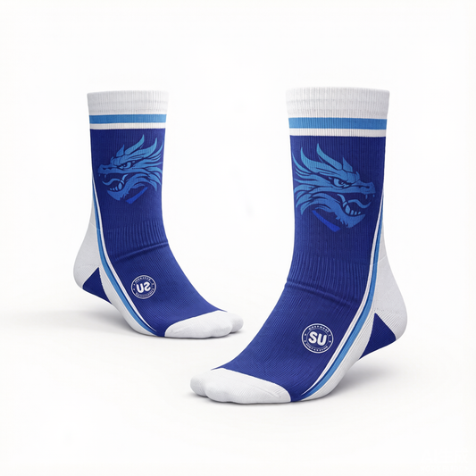 Southern Apparel’s Southern ELITE Mid Socks in blue and white feature a stylized dragon design on the sides, a circular logo near the ankle, and a white band at the top. Engineered for match-day performance, these socks provide superior moisture control to keep you comfortable both on and off the field.
